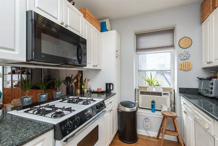 Welcome home to this inviting 2 bedroom 1 bath condo with a generous size terrace and common landscaped outdoor space in Downtown Jersey City. Unit features hardwood floors, central AC & heat, laundry in the unit...