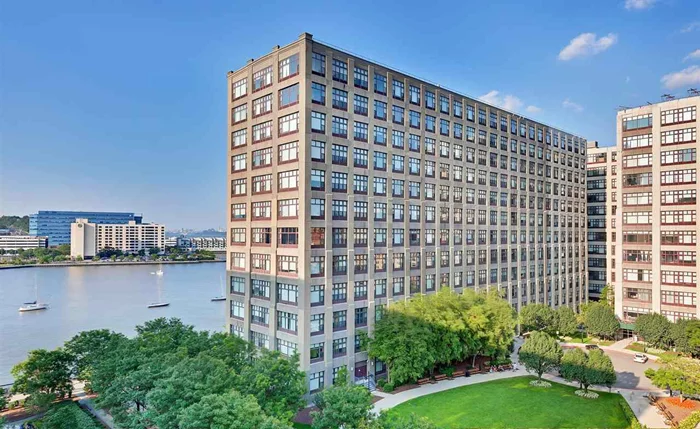 Experience the beauty and conveniences of waterfront living at the highly desirable loft style Hudson Tea Bldg! A TRUE 1 bedroom with 835 Sqft of living space. Dramatic 13' ceilings and 10'12' picture windows create a beautiful space and lots of natural light. Unit features Frigidaire stainless steel appliances, new Kenmore washer/dryer, Hunter Douglas custom blinds, upgraded AC unit and hardwood floors throughout. Equipped for Optimum and Verizon FIOS service. Full service amenities include 24hr concierge, elevator, Choc o Pain Cafe, large fitness center (including classes such as Yoga, Barre/HIIT, and Peloton bikes), residents lounge, children's playroom and dry cleaner. Commuter's dream with private shuttle to PATH and steps away to NYC Ferry and bus.