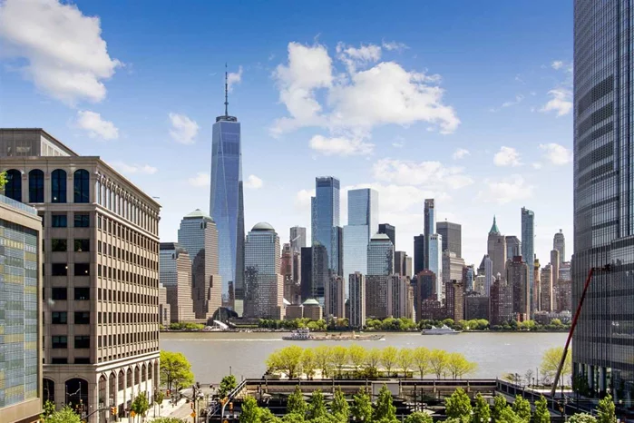 Luxury Urban Living at its Finest in The Waterfront District with Direct Manhattan Views! This magnificent penthouse (with keyed elevator) is on the market for the first time ever and is located in a high-end boutique condo building on one of the most desirable and historic streets in the Paulus Hook area of Jersey City. From the moment you enter the home, the Manhattan and NJ Gold Coast views of will leave you in awe and you will see why this is a once-in-a-lifetime opportunity. In addition to having amazing views, included with this home is a 180 degree private wraparound outdoor space with access from almost every room in the house via French doors. The open layout of the home offers a contemporary living space with timeless details and a has all of the modern amenities that you are looking for: two massive king-size bedrooms, one with direct NYC views and an en-suite bath, an open chef's kitchen (with Sub-Zero refrigerator, Thermador gas stove, Bosch dishwasher, custom cabinetry and an expansive granite countertop) perfect for entertaining, custom walk-in closet and a walk-in laundry room with pantry storage. You will bask in exceptional sunlight all day long with this penthouse's exposure, facing East, North and South. But if that is not enough, the home is also equipped with a double-wide garage parking spot, two enormous private storage rooms, providing amble square footage for all of your spacial needs, as well as having roof-rights. Some shared building amenities include a bike room, a backyard garden, secured entry with cameras and an elegant marble entry. Situated only two blocks from Exchange Place PATH, five blocks to Grove Street PATH and near dozens of restaurants, shopping, parks, ferries and schools...convenience is not an issue for this home and it needs to be on your list.