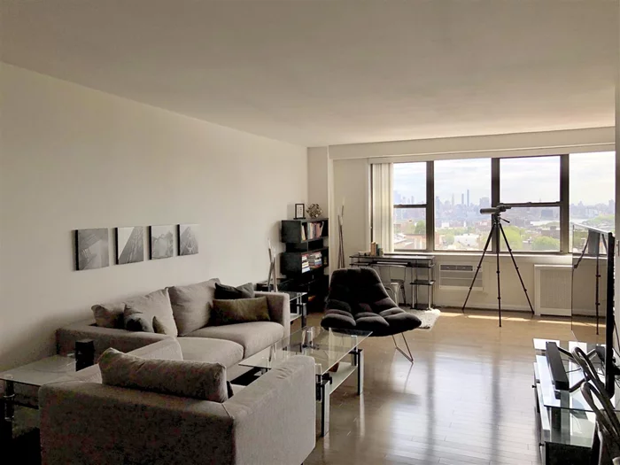 Impeccably upgraded distinguished residence at the Lenox Condominiums. Located on the 12th floor, this condo is the largest one-bedroom floor plan in the complex. Enjoy gazing out your picture windows at the NYC skyline while relaxing in your oversized living and sleeping areas. Cook in your ultra-modern galley kitchen that has white quartz countertops, a breakfast bar with picture window opening, soft closing white gloss cabinets, stainless steel appliances and an under-counter washer/dryer. Perfect for entertaining, this open concept living space has a custom designed built-in bar with a wine refrigerator, recessed lighting and display shelving. Newly installed custom blinds in both living and sleeping areas and hardwood floors throughout. Additionally there is a home office space and a separate dining area right off the kitchen. This unit also includes a built-in glass shelving unit and wall mounted metal decor. Relax in your spa-style bath with subway tile, frameless glass shower doors and white gloss vanity. Conveniently located close to the Hoboken and JC Heights border, Trader Joe's, NYC bus, parks and shopping malls. Included in the HOA are heat, hot water, cooking gas, 24-hour concierge, Path shuttle, fitness center and residents's lounge. Tax abatement in place until 2023. Rental parking $150/mo, resident garden $25/year and free indoor swimming pool access at the nearby recreation center. Comfort and luxury await you. Please see video links attached. https://www.youtube.com/watch?v=OBSAD--T5mI&feature=youtu.behttps%3A%2F%2Fyoutu.be%2FQuM9C_tVi7s https://www.youtube.com/watch?v=QuM9C_tVi7s&feature=youtu.be