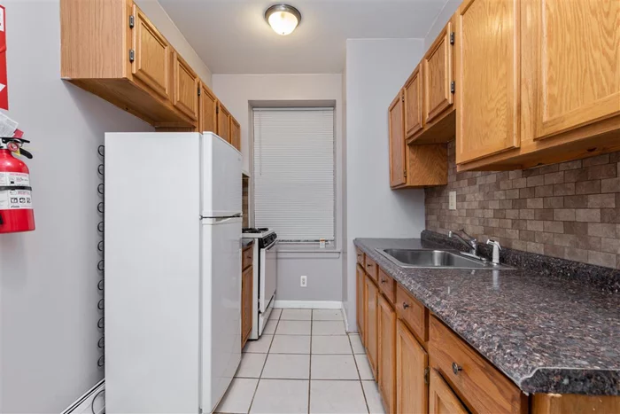 Fantastic move in ready one bedroom located within walking proximity to the JSQ path! The recently painted unit features a galley-style eat in kitchen, hardwood floors throughout, and a nice sized living room with storage. The building features onsite laundry as well as a private common patio space. Heat and hot water included in monthly HOA. Located near shops, restaurants, banking, supermarkets, and easy access to the highway.