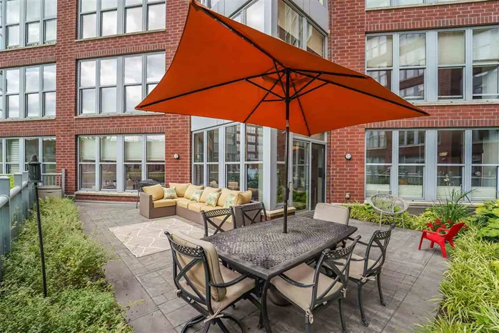 Rare Opportunity for a Home On the Courtyard at Maxwell Place! Large 2 Br + den/office provides flexibility and can be used as a 3 Br & 2.5 baths with 1573 SqFt. Relax on your private courtyard patio with approx 660 SqFt for dining al fresco and lounging on sectional couch. Chef's kitchen features granite counters, custom cabinets, ss appliances & large island. Master bedroom large enough for king size bed and desk. Community features 24 hour concierge, 2 gyms, 2 pools, landscaped roof gardens w bbq's, tv & fire place, community rm w direct NYC views & theatre. Commuters delight..ferry or bus to NYC located around the corner or take the private shuttle to the path. Deeded parking included