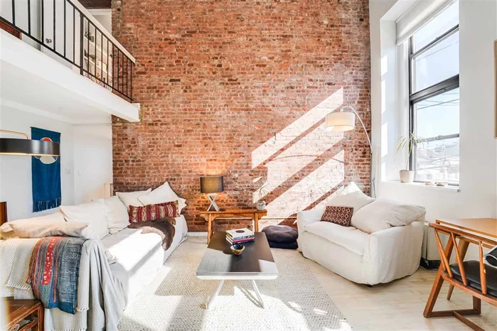 18 ft ceilings, exposed brick, The Schoolhouse at 464 Central Avenue. large 3 bedroom duplex with 18 ft ceilings giving the space and comfort that you deserve. The home was renovated in 2016 and is equipped with a modern eat in kitchen with white custom cabinets and stainless steel appliances. The living area is flooded with light with 9 ft windows and 18 ft ceilings. 3rd br on the lower floor has a working wood burning fireplace and full bathroom. The upper level has 2 bedrooms and full bathroom. Other great features include hardwood floors and an in home washer and dryer. Bldg has a parking lot that is only $100 a month. Shopping, restaurants and conveniences across the street.