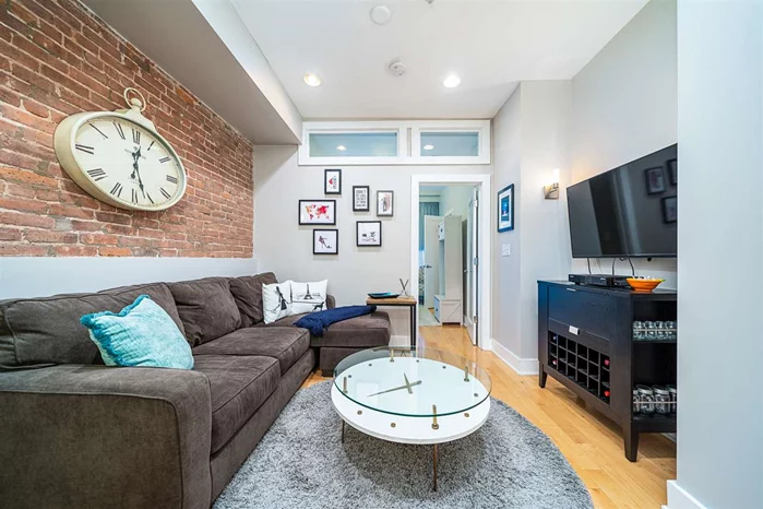 Cozy and charming, this spacious 2 bedroom, 1.5 bath condo in downtown Hoboken is move-in ready. Featuring new appliances, this meticulous second-floor unit also includes central air and washer/dryer. Exposed brick is splashed throughout both bedrooms, which are ideally located on opposite ends - one of which can be used as a home office - in addition to the warm living space. This alluring property also boasts a private outdoor terrace and 10 ft. ceilings. A short walk to public transportation, including NJ Transit and the PATH, this ideal location is also home to some of Hoboken's most notable restaurants, with in-and-outdoor dining accessible. Access to storage in the basement and garage parking a very short distance away.