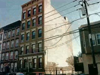 BRIGHT SPACIOUS RENOVATED 1 BD W/ HW FLRS, TIN CEILING, TRACK LIGHTING, SKYLIGHT, STAINED GLASS, EXPOSED BRICK - BLDG NEW ROOF + STORAGE FOR THE UNIT.