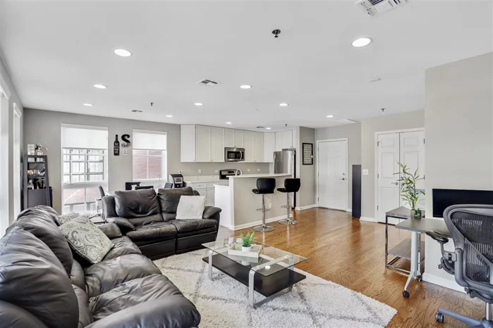 Don't miss this incredible, newly renovated, oversized 1BD/1BA oasis with high-end upgrades for a modern lifestyle in downtown Hoboken! This massive corner unit offers tons of natural light with oversized windows throughout, keeping it sunlit year round. The stunning chef's kitchen features breathtaking quartz countertops, new stainless steel appliances, and white shaker cabinets. Upgrades abound with custom closets, a recently updated bathroom, recessed lighting, a nest thermostat, and a new water heater.  Boasting over 930 SF, this gorgeous unit offers space for a large seating area, a work from home set up, a dedicated dining area and plenty of space to spare, making it an entertainer's delight! Top it off with an abundance of storage space including a coat closet, pantry, 2 closets in the bedroom and more.  All this in a professionally managed concrete/steel construction building with 2 elevators, a gym, a large outdoor courtyard with BBQ grills, and a rooftop patio to take in the sun. Recently updated hallways offer a modern vibe to the building.  LOW HOA fees (just $251.32 / mo) include water. Located by the new Southwest Park, just 2 blocks to the Light Rail, with easy access to Blue Hop, Path and Buses to NYC. Easy to get in and out of Hoboken and easy access to major highways and Jersey City.