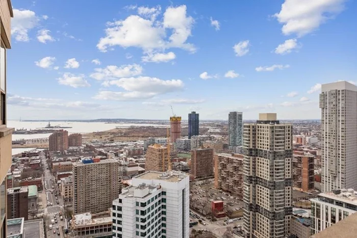 A sun-drenched home on the 42nd floor overlooking the Statue of Liberty and Jersey City downtown in the highly sought-after 88 Morgan St. A very well-maintained unit features two-direction exposures (W and S), oversized windows, double bathroom vanity, generous living and storage space (843 Sq Ft), custom window shades, etc. 88 Morgan Street is a full-service building featuring 24-hr concierge and doorman and on-site super. 41, 000 Sq Ft of amenity space features a lounge, business bar, game room, media room, demo kitchen and kids room which were newly renovated in 2019 with luxurious new portals, cabinetry, Italian marble surfaces with customized state-of-the-art lighting and all new furniture and decor. Amenities include one of the area's best equipped gyms, children's outdoor playground, heated outdoor pool, cabanas, jacuzzi, dry and wet saunas, billiard room, golf simulator, ping pong room, etc. This superb location is conveniently located blocks from Harborside Park, ShopRite, BJ's, shopping and dining. Whole Foods will open one block away in 2021. Ferry to NYC, Exchange Place & Grove PATH stations, and the Harborside Light Rail Station are at doorstep. CVS, CycleBar, and cafe on premises. Garage parking is available for rent at $320/m. A must-see! Walk-through video is available on YouTube.com -- please search with the street name and unit number.