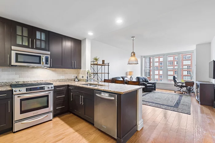 OPEN HOUSE Saturday 9/25 12-2PM! Come be a part of Hoboken's highly sought-after luxury waterfront community in this stunning and spacious 1BR/1.5BA condo with sweeping Midtown NYC Views and deeded parking spot. Large open kitchen features granite counters and stainless steel appliances. Bedroom can easily fit a king size bed and has 2 great closets. Master bath is equipped with dual sinks, a shower and a separate tub. Community offers 24-Hour concierge, roof deck, grills, pools, residence lounge, courtyard, fitness centers, shuttle to & from path.