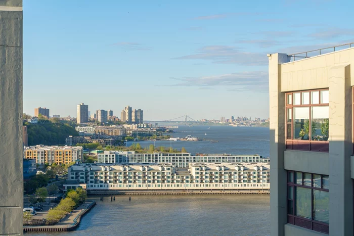 Upon entering, you'll immediately appreciate the abundance of natural light and expansive views up to the George Washington Bridge, from your 1200 sqft 2 bedroom 2 bath loft Penthouse in the sky, with covered garage parking spot INCLUDED, at the iconic Hudson Tea Building. Welcome home to Residence 12U, with its open concept butterfly layout, 14-foot lofted ceilings with exposed concrete beams, and northern Hudson River views from your 10 ft picture windows allowing for all day natural sunlight! This PH loft has a spacious, chef's kitchen perfect for entertaining, featuring a custom stone breakfast bar with endless counter space & seating for 4 stools, abundant 42 shaker style cabinetry, stainless steel appliances, overhead lighting, and a custom backsplash. The adjacent dining area easily fits a table of 6 to host the most incredible dinner parties and opens up to the living area for optimal space. On each wing of the loft, you'll find two generously sized 17x11' bedrooms, both easily fitting a king bed, with custom Hunter Douglas blackout shades. The primary bedroom is outfitted with custom California Closet organizers and a spa-like marble en-suite bath with walk-in shower & linen closet! The second bedroom comes complete with a spacious Elfa-designed walk-in closet organization system, plus a rare, massive overhead storage attic. This Hudson Tea Penthouse loft is further enhanced by all-natural hardwood floors, overhead lighting and ceiling fans, full-size in-unit washer/dryer, and entryway foyer complete with coat closet rounding out this incredible space. The Hudson Tea's full service luxe amenities include 24 hour highly skilled concierge service, nearly 3000 sqft gym with fitness classes (adult & kids yoga, barre & HIIT classes, offered in person!), kids redesigned playroom & resident lounge with fireplace, wet bar & dining room, 3 modernized high-speed elevators, FREE shuttle to and from PATH, dry cleaner, & Choc O Pain French cafe' onsite! Brand New shared WFH space coming late SPRING! Located directly on the Uptown Hudson River waterfront promenade to pop outside for a stroll or bike ride, vibrant boutique shopping & bars, Cork Wine & Cheese shop, Daybase, Soul Cycle, Club Pilates, & outdoor eateries, Direct Ferry from 14th St. to Midtown & WFC, 126 Bus to Port Authority, Trader Joe's, Whole Foods, Uptown farmer's market and so much more!!!