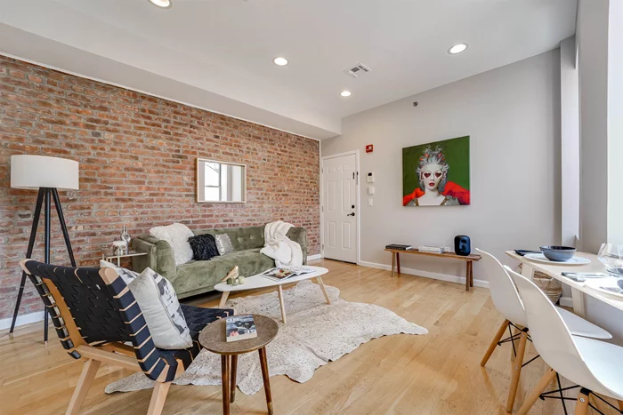 Welcome to this charming sunlit 2 bedroom condo in the heart of Jersey City Height at The Juliette! Situated on a quiet street, this unit features an open floor plan, a modern kitchen and 2 full baths, hardwood floors, exposed brick, central A/C, and in-unit washer/dryer. Walking distance to downtown Jersey City, Hoboken, PATH stations, light rail, restaurants and bars and close to Riverview Fisk Park with its arts programs, farmers market, and views of the NYC skyline, this location has it all! Low taxes and HOA, move in ready and priced to sell - this is the place you've been looking for!