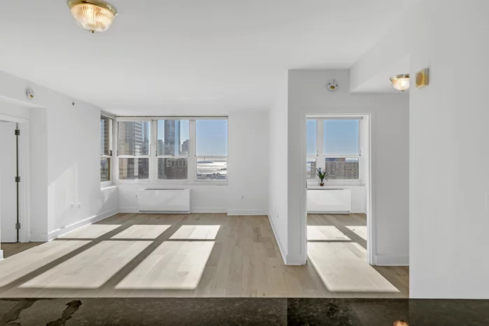 Welcome to your next step, the next chapter with unit 2306 at 88 Morgan! This lovely 2 bedroom 2 bath home is warm and inviting, blessed with amazing sunlight throughout the whole day. Once you step in you are welcomed with the wonderful and nourishing rays from the sun. 2306 has picture perfect views of Manhattan to the east, the Hudson Bay & Statue of Liberty and more to the South.  The open floor plan has a graceful flow through the kitchen, living room and dining room. You'll have every convenience to effortlessly entertain family and friends, right at home. The spacious open kitchen is equipped with ample prep space on black galaxy granite countertops, generous storage with the custom cabinetry, and top appliances. Residents enjoy the convenience and comfort of super friendly and well trained staff, complete with 24 hour doorman service, and main floor concierge and amenity floor concierges. The 7th floor amenity level boasts 42, 000 sqft and you can consider it an extension of your home. Residents enjoy the fun of the game room with billiards, foosball, shuffleboard, and ping pong. Golf lovers can play year round and practice their swing and put in the state of the art virtual golf simulator. Work or study at the business bar with wifi access. Want to celebrate a birthday, engagement or baby shower? Then you can host it fabulously in the connecting formal living room, dining rooms and kitchen. De-stress yourself and stay fit in the expansive gym, complete with many state-of-the-art weight, cardio machines & free weights. Relax after a long day in the Aqua Grotto along with a steam room and sauna. The deluxe outside playground for all ages and the indoor playroom are great for kids to play in a secluded, private environment. Plans for barbecue grills and fire pit are in store for the near future. The 7th floor will definitely impress you! Location wise, 88 Morgan is conveniently situated closely to all 3 downtown PATH stations, 2 Hudson Light Rail stations, and 2 NY Waterway ferry slips. You can travel and commute to Manhattan in minutes, even stroller and bike friendly. Take a relaxing stroll or jog along the waterfront. The pier and promenade are alive with people, feeling the cool breeze from the Hudson with the backdrop of the city. Convenience is all around, CVS Pharmacy is located beneath 88 Morgan and the Newport Mall is a short walk. Several grocery options will benefit you in proximity including the much anticipated Whole Foods, opening just 2 blocks away! Some of the top schools including the newly expanded PS 16 are a few blocks away. Downtown is filled with many different eateries and trendy restaurants.