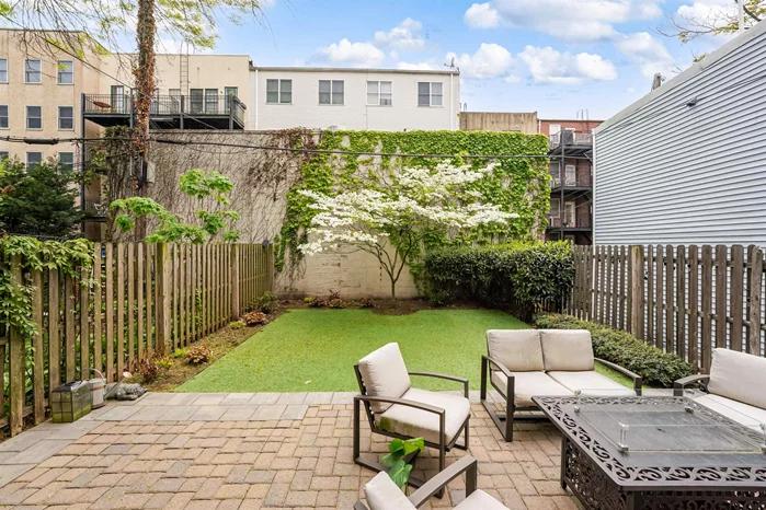 Situated on Park Ave, one of Hoboken's idyllic tree lined streets, this 2 bedroom/ 2 bathroom condo boasts a private terrace and a landscaped 1, 000 SQFT backyard featuring a lush maintenance free synthetic lawn and brick pavers, a true urban oasis. Open layout floor plan features a large living/ dining area and a full chef's kitchen with top of the line Viking appliances and Bosch dishwasher, white shaker style cabinetry, and quartz marble countertops. Modern bathrooms with Toto toilets, glass subway tile surround, mosaic marble floor with Carrera border and accents. Additional features include LG washer/ dryer, tankless water heater, central HVAC, Hunter Douglas window treatments, ample closet space, recessed lighting, and hardwood floors throughout. Convenient location affords you easy access to Hoboken PATH, NJ Transit buses & trains, the Light Rail and NY Waterways Ferry. Municipal parking garage 2 blocks away.