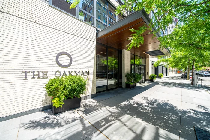 The perfect 1 bedroom + den with private outdoor space located in one of Jersey City's most sought after buildings, The Oakman. This unit features white oak hardwood floors throughout, in-unit Bosch washer/dryer. Chef's kitchen includes SS appliances, Fisher&Paykel fridge, Italian Pedini cabinets, quartz countertop peninsula. The Oakman is a full service luxury building with 24-hour doorman, fitness center, children's playroom, rooftop lounge, outdoor swimming pool, BBQ grills, DVORA in home services, dry cleaning! EV chargers and Valet Parking on-site by 3rd party. Excellent location just 3 blocks from the Grove St PATH and surrounded by great dining, shopping & farmers market. 20 year Tax Abatement with 13 years left. This is a Sponsor Unit