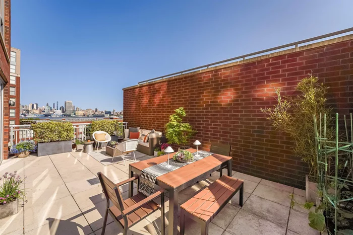The stunning and expansive terrace with exceptional NYC and Hudson River views is the icing on the cake of this fabulous light-filled 1500+ sf, 2 bed/ 2.5 bath home at the very desirable Maxwell Place. This residence offers the perfect retreat for relaxing and entertaining. From the wall of east facing windows in the living room to the broad south facing windows throughout, this home is drenched in wonderful natural light! An airy, oversized open floor plan accommodates both living and dining areas, and includes a custom built-in bar with a Sub-Zero wine refrigerator and additional storage. A well-appointed kitchen equipped with stainless steel appliances and an abundance of cabinets offers plenty of counter space for cooking, meal prep and seating, too! The primary bedroom is massive and overlooks the terrace, offering two closets and a spacious bathroom. The large second bedroom has an en-suite bathroom as well and a substantial walk-in closet. The entrance hall has a huge closet, laundry and a half bathroom. Steps away from the pool and residence lounge, this unit is perfectly situated to take advantage of some of the building's best features and it comes with deeded parking! The location is highly convenient, near to the NYC ferry, bus stops, shopping centers, restaurants, and parks. This luxury building offers a range of amenities, including a 24-hour concierge service, elevators, two gyms, a community room with views of NYC, two pools, and landscaped rooftop.