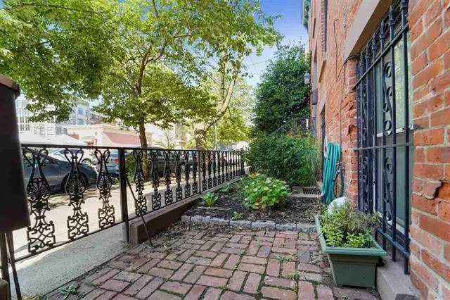 What a unique property, set up on a quiet set back street, but still in he middle of all the action of prestigious Down-Town Jersey City. This 1125 Sqft garden level 1 bed apartment is an entertainers dream! Gorgeous and huge, shared backyard, with your own private spot right outside your window. Unit features beautifully redone floors, fireplace and spectacularly remodeled chefs kitchen! All of this in a small 4 unit building with FREE laundry located on the 1st floor! Located on a dead end street, near Van Vorst Park, schools, shopping, restaurants, nightlife and more! JC's beloved diner is just around the corner. Very easy to find free public parking on the street as well. Call the Listing agent to learn how to make this beautiful property yours now!