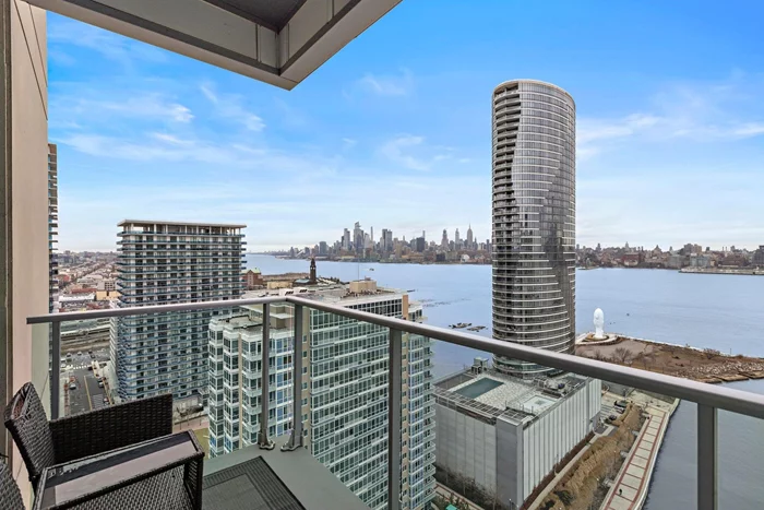 Come live in the sky in this rare-to-find 2bd/2ba/1335sqft corner unit in JC's most prestigious complex in the Shore North! Upon entrance, you'll be taken away by the unparalleled panoramic views of the majestic Hudson River, stretching from the iconic George Washington Bridge all the way to the Verrazzano-Narrows Bridge. The spacious layout of this home seamlessly blends modern design with functionality, offering an ideal space for both relaxation and entertainment. Chef's kitchen features top of the line appliances,  24-inch custom tiles, marble granite countertops, and a lavish diamond-cut backsplash.  In the living and dining rooms you will be surrounded with floor-to-ceiling windows, which flood the space with natural light and grant access to once-in-a-lifetime views of NYC. Around the corner, you can indulge in a spacious master bedroom with direct views of the Empire State Building. With hardwood flooring throughout, access to a private balcony, and 1335 square feet of living space, this home is too good to pass up. Amenities include a sky lounge, Jacuzzi, sauna & steam room, private gym, kids' playroom, game room and conference room. Come schedule a showing!