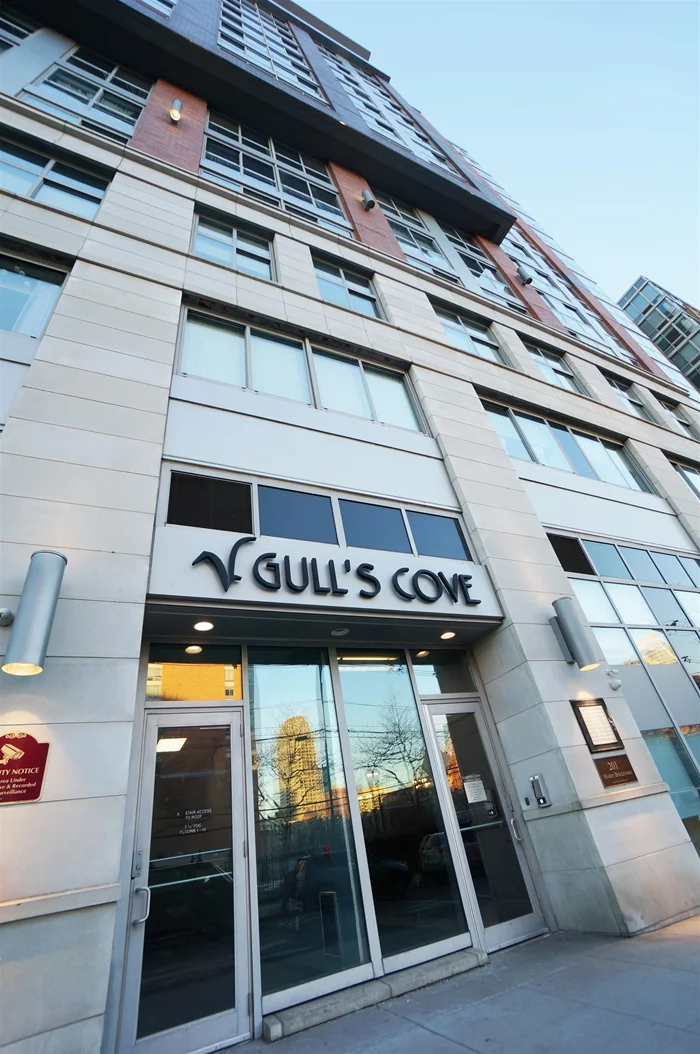 Gulls Cove-Stunning and spacious 780 sf SOUTH facing 1 Bedroom 1 Bathroom unit with partial NYC skyline, Hudson River & Courtyard view. The unit features central HVAC, W/D in unit, a living room with floor to ceiling windows welcomes tons of natural lights, hardwood floors, open layout kitchen with granite countertop and newer stainless steel appliances. The bedroom is large enough to accommodate a king size bed and has a good size walk-in closet. The luxurious and unique condo offers amenities with 24HR concierge, fitness room, children's playroom, yoga room, bowling alley and outdoor garden type courtyard on the 4th floor. Walking distance to PATH station and right across from the light rail station and also can easily access to shopping, restaurants, parks, major highways & ferry terminals.