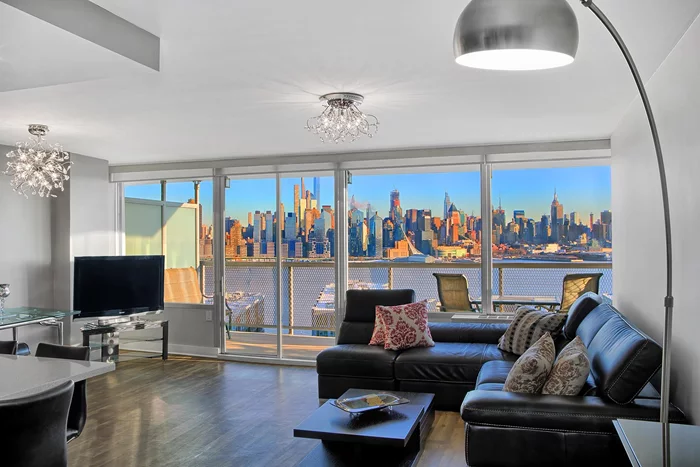 VIEWTOPIA -Soaring with Modern Style & World-class Iconic NYC Skyline Views over the River-that Overwhelms the Senses! Step into urban luxury living in this 2 Bedroom 2 Bath condo with coveted New Balcony. An Idyllic, elevated bluff top location benefits sweeping, unobstructed So. Eastern views of countless captivating landmark sites. From sparkling Empire State to glittering Hudson Yards, shining Freedom Tower at every turn-everywhere. Very special, So. Eastern exposure in the Building affords glowing sunlight from walls of glass. Having a large 100+- sq. ft balcony; to enjoy outdoor living is a rare, true luxury. The details speak volumes-emerging from a Remarkable Renovation-with upscale, luxury finishes-the results are dazzling. Offering a generous 1350+-sq. ft. open concept floor-plan that embraces the way we want to live now. The well-appointed Modern Chef's Kitchen features abundant, sleek, custom cabinetry, SS Samsung appliances, French door fridge, Quartz counters, glass tiled backsplash & fabulous tiled floors. The enormous 6 ft. long Quartz dining peninsula, sets the stage for gatherings, hosting & everyday alike. The Beauty continues in the serene & spacious King-sized Master Bedroom with en-suite, Modern Bath, porcelain tiled walls & floors. The 2nd bedroom offers comfortable space with amazing views! A 2nd luxurious Modern full bath w/ shower is off the hallway. Custom closets thru out, option to install W/D. This condo is in Mint condition, everything has been done for you. Just move right in & Enjoy! Come & Experience urban luxury living in a prime location. HOA includes ALL UTILITIES; Heat, A/C, Electric; Gas; Water+ Amenities: Pool; Patio Lounge w/ Grills; Fitness; sauna; 1 Pking space; 24hr Concierge; Guest Pking; Live-in-Super; Maintenance on site! Cats only, EMS/Service Dogs. Discover Tower West Luxury CONDO Building ideally located on Desirable BLVD East, surrounded by terrific shopping, dining, New Park, Tennis courts; A 5-Mile hassle free commute to NYC is right outside your door. Don't Miss Out!