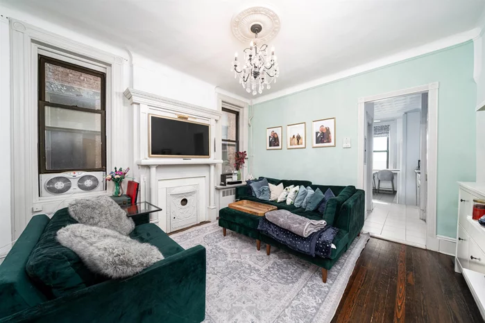A rare opportunity to live in one of Hoboken's historic limestone buildings on Park Avenue. This stunning turn-of-the-century building is nestled on a charming tree lined street and considered one of Uptown Hoboken's premier locations. 1112 Park Avenue is the city's one and only row home building that features a common courtyard, heated pool and gym! This lovely 2 bedroom, 1 bath Victorian home is a tasteful blend of old world charm and modern finishes throughout its open flow layout, with 9 foot ceilings, French doors, original mantle, exposed brick and hardwood floors. An abundance of natural light pour through 10 over-sized windows and the front bay window has partial NYC views of the Empire State Building and Freedom Tower. Fully renovated bathroom and kitchen. Custom built-in office space. Washer/dryer in unit. Individual gated storage space, bike racks, and additional washers/dryers in the basement. Residents also enjoy access to a fully equipped, modern fitness center and grill/picnic area. Easy access into NYC by bus or ferry. Short stroll to parks, retail, restaurants and waterfront recreation.