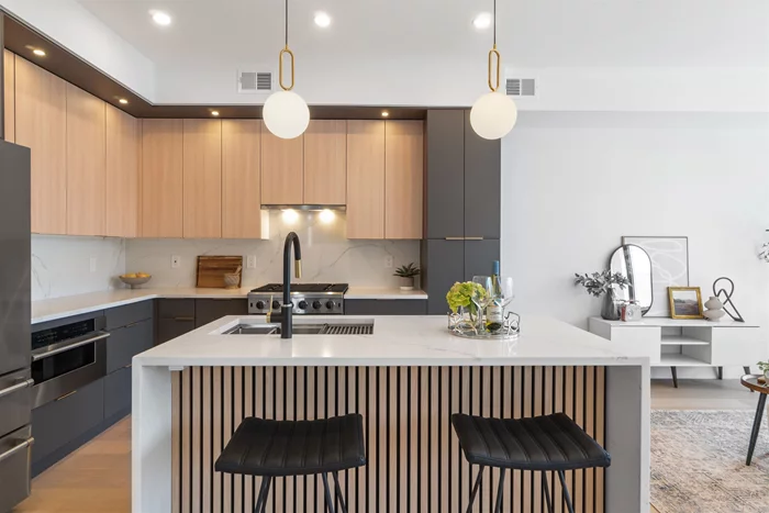 OPEN HOUSE 5/18 FROM 12-2PM! Welcome to the condos at 67 Laidlaw Ave, located on one of the most sought-after streets in Jersey City Heights and perfectly situated between both Central and Palisade Ave. Consisting of two luxuriously fully renovated units, each is bathed in light and features crisp modern design, serene outdoor spaces and 1 prepaid parking space located across the street for 1 year. Unit 2 is a sun-drenched 4 bedroom, 2 full bath top floor home with a large private roof-deck that boasts NYC views. The unit features a fully open-concept layout with soaring high ceilings and light-filled interiors framed by custom Pella Lifestyle casement windows. As you step in, your eye is drawn to the massive south-facing windows that let in tons of sunlight and the wide-plank white oak floors that run throughout the home. The kitchen wows with two-toned European-style oak veneer and matte gray cabinets. Kitchen islands feature Calacatta quartz countertops and waterfall edges. Pro-style luxury stainless steel appliances include a gas range with sleek vented hood, microwave drawer, large French door refrigerator and dishwasher. A cute bar niche with a must-have wine fridge makes this an impressive entertainment space. The massive light-filled primary bedroom features tall bay windows, an original marble Victorian fireplace, extra-large private en-suite bathroom and walk-in closet. Two spacious guest bedrooms, an additional office or 4th bedroom, large guest bathroom, and dedicated laundry-room provide all the space for today's home-buyer. Both bathrooms feature elegant design, porcelain tiles, Delta shower fixtures and floating vanities; the master bath also provides an additional luxury with its heated floors. Take the party upstairs on your large private roof-deck which is fully equipped for entertaining with direct gas, water and electric connections. Other features include all new high efficiency central HVAC with Nest thermostat, tank-less water heater, superior noise suppression design, smart lighting, security cameras/Ring doorbell and brand new roof. A free secured parking space for a year makes this a must-see! Close to shopping, dining, parks and a range of transport options. Commute to NYC in under 30 minutes! Hard hat tours available now. Square footages are approximate. *Borrowers may qualify for .5% Lender Credit up to $4, 000*