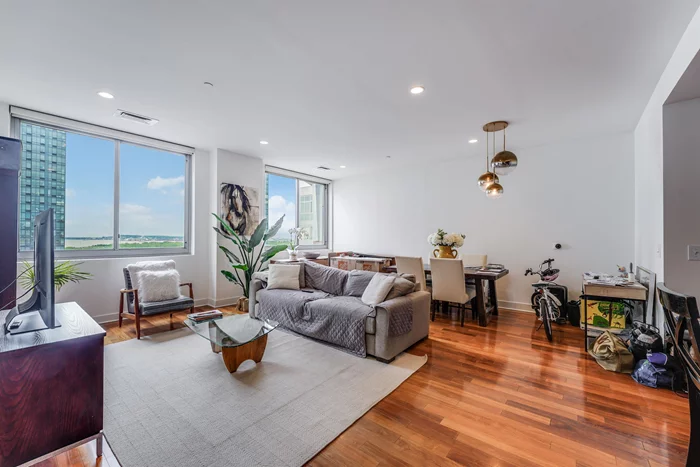 OPEN HOUSE 12-2PM! SUNDAY Welcome home to this RARE South Facing Sun Drenched 3 Bed (2+den) residence at Gull's Cove, in the highly desirable Paulus Hook section of Downtown Jersey City.  This spacious residence features large living space, Harbor/water views, a master bedroom with three large custom closets, soaring high 9.5' Ceilings & 1 car parking garage spot purchase for an addtional $40k. Gull's Cove is a full amenity building with 24/7 concierge, lounge, common outdoor courtyards, fitness center & a game room with kids play center, bowling alley and more! Tax abatement until 2028. Conveniently located with easy commute to NYC, you can either walk to Grove St PATH 5 blocks or head to exchange place via Lightrail right outside your door. Enjoy downtown living at it's finest! Excellent No. 16 Elementary School.