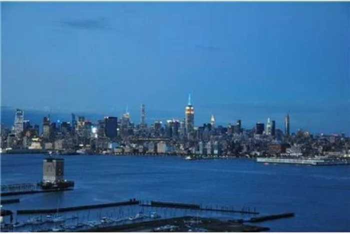 Welcome to your dream home in the most desirable Downtown Jersey City Waterfront! Breathtaking views of Empire State Building nestled with the iconic New York City skyline from living room and the bedroom. The spacious bedroom provides a retreat-like atmosphere, offering stunning NYC views and includes a closet in bedroom with wooden floor in living and stainless-steel appliances in the kitchen. This home is located on the top floor (Penthouse) and has one dedicated (deeded) secure garage parking space located inside the building on the lower floors with security cameras and 24/7 concierge service, a rarity in bustling Jersey City. The building itself will seal the deal with its beautiful lobby and it offers a serene, heated pool area, an on-site doorman, state-of-the-art gym, residents lounge, game room, business lounge, BBQ grills, and playroom. Step outside your home and find easy access to PATH stations, light rail, and the ferry to NYC, making commuting a breeze and the River Waterfront Walkway is minutes away, offering splendid view of Manhattan. The Newport Mall and the newly opened Whole Foods is just moments away, offering convenience at your doorstep. Maintenance fee includes internet and DirecTV with HBO Max & water. It is an amazing opportunity to experience urban living with great a community vibe!