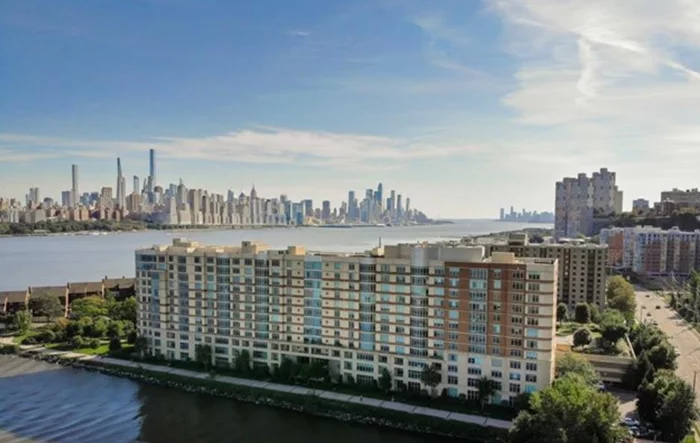 Fantastic panoramic views of NYC skyline and Hudson river from the luxury condo, Watermark! Spacious 2 bed & 2 baths with 1, 269 sqft. Open-concept kitchen with granite countertop and stainless steel appliances.2 parking spaces. Luxury building amenities include: doorman, 24 hr concierge, valet parking, indoor/outdoor heated pools, fitness center w/sauna, steam, and massage room, movie theater, billiard room, indoor golf simulator, and more. Gas & water are included in hoa. Very convenient with NYC bus righton River road and free shuttle service to Port Imperial ferry.