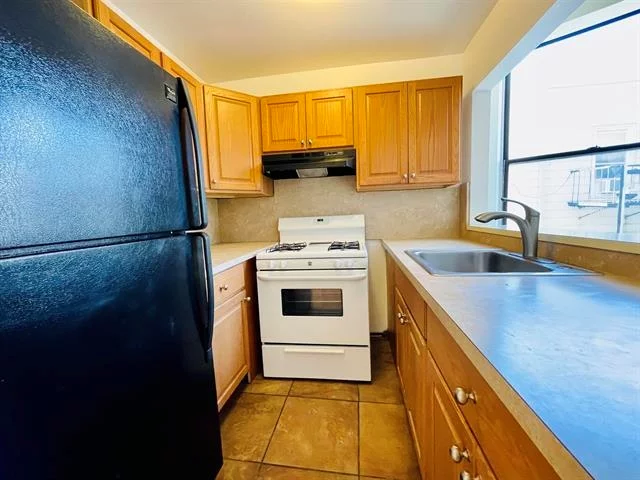 Newly refurbished 2 bedroom, one bath apartment, 862 sq. ft. Nice layout with gleaming hardwood floors throughout, tiled bathroom, plenty of closets and laundry on premises! Convenient to shopping and buses to NYC & Journal Sq PATH and all major highways. Can be purchased as a package with three other units providing a prime investment for a savvy investor!