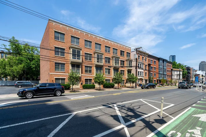 Experience Urban Living at its Finest. Charming Contemporary Duplex in Historic Downtown Jersey City. Welcome to this delightful duplex townhouse condo, situated in the sought-after Van Vorst Park neighborhood. This thoughtfully designed home offers a spacious and light-filled interior, perfect for both everyday living and entertaining. The well appointed kitchen features wrap around island and high quality appliances. Host memorable meals in the formal dining area or enjoy outdoor cooking on your private terrace. An additional flexible space adjacent to the dining area can be transformed into an office, family room, or library to suit your needs. The inviting living room showcases beautiful vaulted-style ceilings, tasteful custom paint, and large windows that allow an abundance of natural light to fill the space. A conveniently located laundry room completes this level. Unwind in the generous primary suite, which includes custom closet and a private bathroom. Additional bedrooms offer terrace access and a shared bath, providing comfortable accommodations for family and guests. This residence also features attractive dark wood flooring, high ceilings, custom lighting, and a covered parking space for added convenience. Located just moments from Path, Light Rail, parks ferry service, boutique shopping, charming cafes, and Restaurant Row. This exceptional downtown home offers and ideal urban living experience.