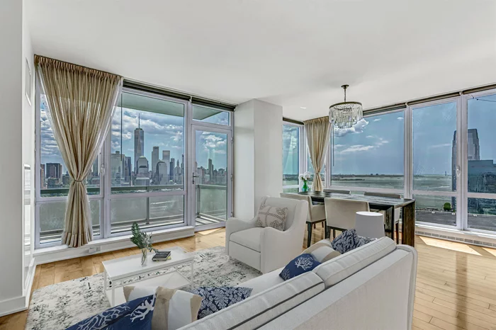 Experience unparalleled luxury and sophistication in this stunning condo, offering magnificent views of NEW YORK CITY's iconic skyline. This SOUTH-EAST facing, CORNER UNIT and large unit of almost 1400 sqft and FREE valet garage parking, this luxurious lifestyle has it all! Enjoy the great tax saving with Jersey City TAX ABATEMENT PROGRAM and LOW MONTHY HOA. Located in one of the most prestigious and sought after buildings in Jersey City. The Crystal Point boasts exceptional design and premium finishes throughout, creating an opulent urban retreat and the convenience of valet parking included. As you step into the expansive living area, you are greeted by floor-to-ceiling windows that frame breathtaking panoramic views of New York City from the open living room, dining area and the balcony. The open floor plan seamlessly connects the living room, dining area, and gourmet kitchen, making it perfect for both relaxed living and elegant entertaining. The state-of-the-art kitchen is a chef's dream, featuring top-of-the-line stainless steel appliances, elegant cabinetry, sleek countertops, and a spacious island with breakfast bar seating area. The primary suite is a true sanctuary, offering stunning city views, and a luxurious en-suite bathroom. Indulge in the spa-like ambiance with a deep soaking tub, glass-enclosed rain shower, double vanities. The additional bedroom also offers ample space, custom closets, and an en-suite bathroom, ensuring comfort and privacy for guests. This luxury condo is equipped with modern conveniences such as an extra powder room for your guests, an in-unit washer/dryer, NEST thermostats, and abundant closet space. One FREE valet garage parking spot is included for your convenience. Residents of this prestigious building enjoy exclusive access to an array of amenities, including a 24-hour concierge. State-of-the art amenities offering New York City City's stunning views from the fitness center, outdoor pool, barbecue area, a rooftop deck, a resident lounge, a yoga room, a jacuzzi, a sauna, a steam room, a screening room, a confernce room, a playroom, an outside play area and a conference room,  Situated just steps from the Newport and Exchange Place PATH stations, this location offers easy access to Manhattan and the surrounding area. Enjoy the convenience of being blocks from the ferry, light rail, supermarket, restaurants, and shops. Indulge in the ultimate luxury living experience with unmatched views of New York City at Crystal Point. This exceptional condo offers a lifestyle of elegance, comfort, and convenience, making it the perfect urban retreat for the discerning buyer.