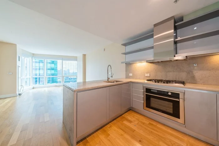 Spacious 525sf studio on high floor with S/W/N exposure at 77 Hudson St. This beautiful studio offers tranquil views of Liberty State Park, Liberty Landing Marina, the Statue of Liberty, and Downtown Jersey City. Features include a large kitchen with Quartz counters, Italian Tabu. Deeded parking available for purchase with extra fee.