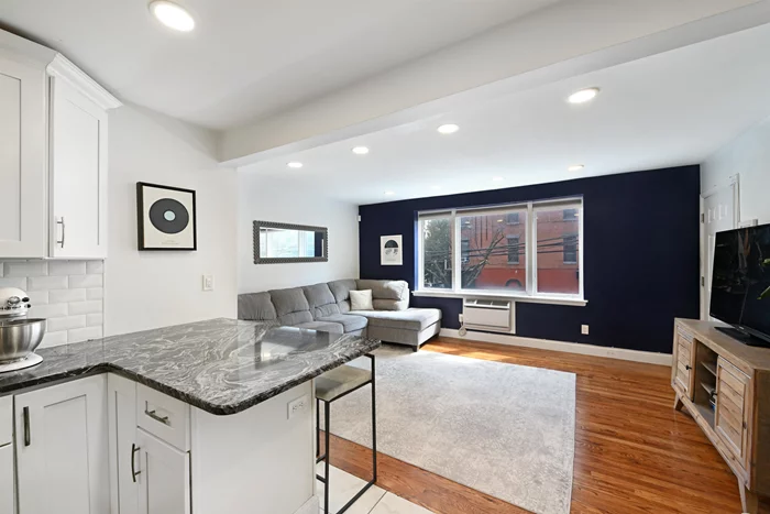 Open House Saturday 10/26 12-2 pm! Entrance on Willow close to 1st St. Welcome to this beautifully renovated 2 bedroom condo, converted in 2019, packed with upgrades and conveniently located just a few blocks from the Hoboken Path Station! This corner unit, situated only one flight up, boasts a spacious and open layout enhanced by rich hardwood flooring and recessed lighting throughout, creating a warm and inviting atmosphere. Modern kitchen boasts sleek stainless steel appliances, granite countertops, soft close cabinets, custom tile backsplash and breakfast bar. The east facing living room gets great natural light and has ample space for relaxation, while the stylish bathroom, complete with a floating vanity, adds a touch of luxury. Both bedrooms are generous in size and feature cordless top-down bottom up blinds for privacy. Enjoy the convenience of a full size in-unit washer and dryer and built in ac. This fantastic location is only steps away from the Hoboken Path, ferry services, and the bus to NYC. It's surrounded by all the great shops, bars, coffee shops and restaurants downtown Hoboken has to offer! One parking space just steps away included for the first year! Low taxes ($6882 2024) and HOA ($375/mo) make buying vs renting an easy decision!