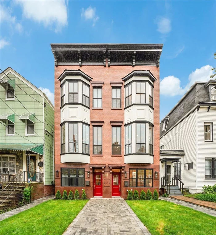 *** OPEN HOUSE 11/16 & 11/17 between 1-3 pm *** Discover the epitome of luxury living at 41 Brinkerhoff St in Jersey City. These stunning ground-up new construction townhomes boast exquisite herringbone floors, offering an elegant touch throughout the dining area and living space. Enjoy the serene privacy of your own backyard and rooftop oasis, perfect for relaxation and entertaining. The heart of the home features a spacious kitchen with a large waterfall island and seating area, complemented by a stone backsplash, custom cabinets, and top-of-the-line Fisher Paykel appliances, including a convection double wall oven, paneled dishwasher, gas 5-burner cooktop with vented hood, pot filler, built-in microwave, and paneled fridge. In addition to the gourmet kitchen, you'll find a chic wet bar with a wine fridge, perfect for hosting gatherings. Freshen up in the stylish powder room adorned with a custom rattan/wood vanity and designer lighting. Retreat to the primary bedroom, where a stunning chandelier illuminates the space. The ensuite bath features a double sink custom vanity and a walk-in shower, offering a spa-like experience. This home seamlessly blends modern luxury with timeless elegance, showcasing custom lighting throughout and exceptional attention to detail. Don't miss the opportunity to make 41 Brinkerhoff St your dream home in Jersey City.