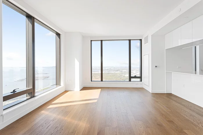 A stunning one-bedroom with breathtaking views of the Manhattan skyline is a rare opportunity to create your dream home of singular beauty. You'll enjoy a modern and comfortable open plan design, floor-to-ceiling windows, and wide oak flooring. Every aspect of the65, 000SF of amenities at 99 Hudson is designed to elevate everyday living, from the expansive 80 50 swimming pool with spacious landscaped lawn, grilling stations, and al fresco dining spaces, to The Hudson Club Room with lounge, library and dining spaces. And experience Hudson River waterfront living with endless shopping, dining, and transportation options, including The Exchange Place PATH station just 500 feet away.