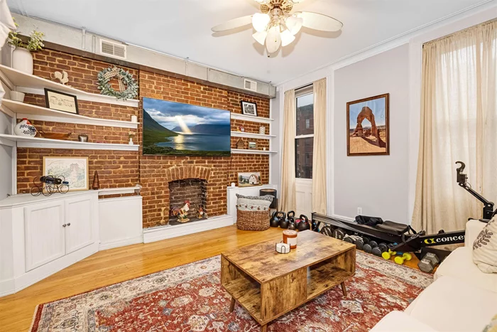 Welcome home to this beautiful and tastefully renovated apartment, conveniently located on Washington & 10th! Historic Hoboken charm and transitional-modern updates come together seamlessly in this spacious 1 bed/1 bath unit that features a bonus back den, hardwood floors, full walls of exposed brick, and 12 ft ceilings. The generous layout includes a sun-drenched LR with decorative fireplace and an eat-in kitchen with granite countertops, farmhouse sink, and gas range w/ double oven. The bedroom offers an entire wall of custom closets and a book nook. The back den provides flexible bonus space perfect for WFH. Other modern updates include an in-unit washer/dryer, newer (2020) windows, and central A/C. Building features a shared back patio with BBQ and private storage space for each unit. Schedule your viewing today!