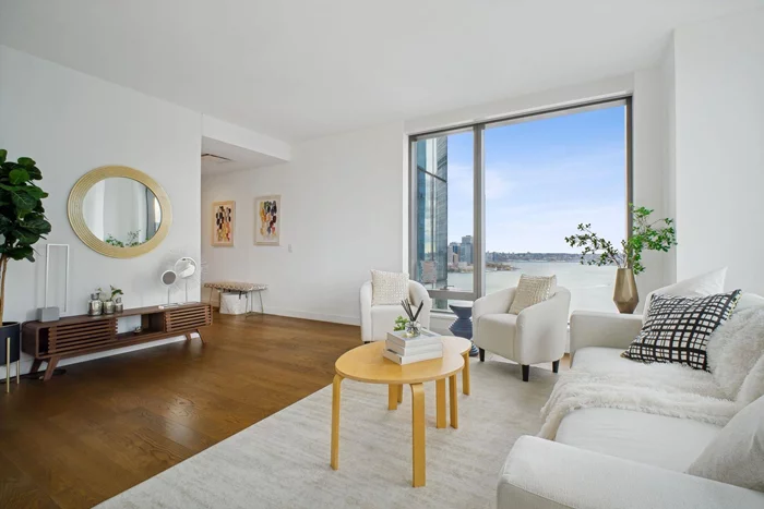 Make this mint, most desirable 11-line home in the iconic 99 Hudson to enjoy world-class luxury. This corner unit features double exposures (SE + SW) with amazing Lower Manhattan and Hudson River views, multiple floor-to-ceiling windows (even in the kitchen) taking in abundant natural light all day long, 5 wide oak flooring throughout, energy-efficient heating and cooling system with individual climate controls, top-of-the-line appliances, Bosch washer and dryer in unit, and generous living and storage space. Other premiere finishes and fixtures include custom Italy-imported high-glass white lacquer cabinetry, full height quartz stone tile backsplash and waterfall island with Quartz stone countertop, Italy-manufactured vented hood, SS fixtures by Kohler and garbage disposal unit in the kitchen, and imported ceramic flooring and wall tiles, custom wood vanity with ceramic countertop, and rainwater shower heads by Kohler in the bathroom. 99 Hudson is a full-service building featuring 24-hr concierge and on-site management and super. 65, 000 sq. ft. of amenity space features expansive 80' x 50' swimming pool with cabanas, multiple grilling stations, Al Fresco dining spaces, spacious landscaped lawn, kids' playground, outdoor dog run, a 3, 800 Sq Ft fitness center, resident lounge, library and dining spaces, demo kitchen, game room, screening room, business center, children's playroom, golf simulator, hot tub and sauna, etc. This superb location is conveniently located blocks from PS 16, multiple parks, shopping and dining. Whole Foods is a couple of blocks away. Ferry to NYC, Exchange Place PATH stations, and the Harborside Light Rail Station are at doorstep. Parking may be available for rent from owners of the building.