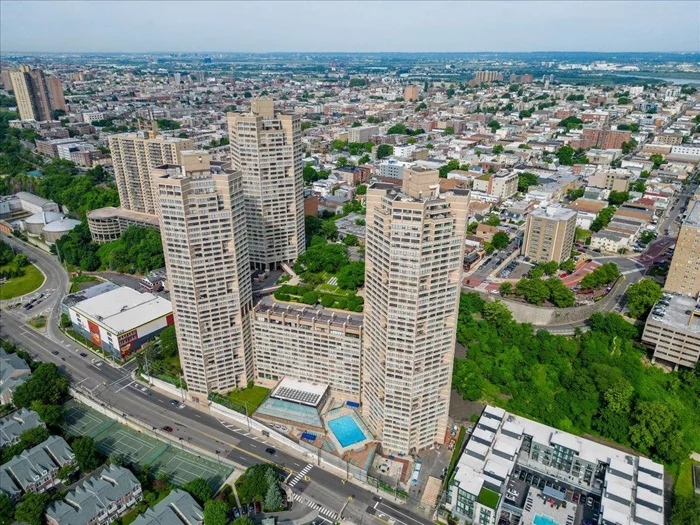 Elevate your lifestyle at Galaxy Towers on the beautiful New Jersey Gold Coast. Discover luxurious living in this stunning 2-bedroom, 2-bath condo perched high above the Palisades. The open concept living and dining area creates an inviting and airy atmosphere with wall to wall windows, perfect for both relaxation and entertaining. Step onto your private terrace, to enjoy sweeping panoramic views and brilliant sunsets. Enjoy the luxury of two generously sized bedrooms, each with ample closet space and one boasting a private ensuite bathroom. Indulge in a resort-style experience with an array of top-notch amenities. Benefit from the 24-hour concierge and door staff services, and stay active in the state-of-the-art cardio fitness center, weight room, and exercise studio. Dive into relaxation with indoor and outdoor pools, a whirlpool spa, sauna, and steam room. Tennis enthusiasts will appreciate the courts, while the private elevated park provides breathtaking NYC views. Convenience is at your fingertips with laundry on your floor, and onsite parking. Eco-friendly features include EV charging stations. The connected Galaxy Mall caters to your everyday needs with its array of restaurants, pharmacy, salon, dry cleaning services and more. Pet lovers will be pleased to know that this community is pet-friendly. Plus, with easy access to Manhattan via the NY Waterway shuttle, ferry, NJ Transit bus, and jitneys, commuting is a breeze. Experience the epitome of sophisticated living at Galaxy Towers  where every detail is crafted just for you.