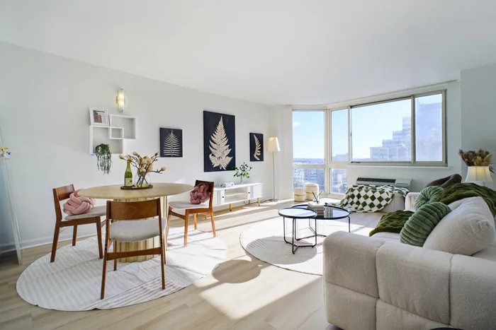 This rare-to-market 2-bedroom, 1-bathroom residence is a true gem, offering a perfect opportunity for first-time buyers and investors alike. With a premium deeded garage parking space conveniently located on the 2nd floor, this home seamlessly combines luxury, convenience, and breathtaking views in one of the Hudson Waterfront's most desirable buildings. The sun-drenched interior boasts a South-facing exposure, providing panoramic views of the Hudson River, Lower Manhattan, and the iconic Freedom Tower. Massive floor-to-ceiling bay windows flood the home with natural light throughout the day, creating a warm and inviting atmosphere. With 925 sq. ft. of efficiently designed space, the practical layout feels much larger, with no wasted square footage. The kitchen is outfitted with brand-new appliances, and the bathroom has been enhanced with a brand-new medicine cabinet. The unit features beautiful new flooring installed in 2023, a washer and dryer updated in 2020, and two new AC units replaced in 2021. The second bedroom comfortably fits a Queen-sized bed, making it versatile as a home office or nursery. The primary bedroom is highlighted by a spacious walk-in closet, offering ample storage to suit any need. Mandalay on the Hudson is a premier luxury building offering residents an array of high-end amenities. From the heated outdoor pool with gas grills to the children's playground and dog run, every feature is designed to enhance your lifestyle. The building also includes a state-of-the-art gym, a business center, and a clubroom equipped with Ping-Pong and billiards tables. For electric vehicle owners, EV charging stations are available in the garage. The 24-hour concierge and doorman, along with an on-site superintendent, ensure a seamless living experience. Situated in a prime location, this home offers unparalleled convenience. Just blocks from the Ferry to NYC, Exchange Place and Newport PATH stations, and Harborside Light Rail, commuting is effortless. Whole Foods is only a short walk away, while Smorgasburg, Harborside Park, ShopRite, BJ's, CVS, Newport Mall, etc. Residents can also enjoy exceptional dining options just steps away. Highlights include Lokal Eatery & Bar and Hudson & Co. with stunning waterfront views, Light Horse Tavern for contemporary American fare, ONDO Jersey City for unique Korean cuisine, and DOMODOMO for its renowned sushi and modern Japanese dining experience. Perfect for food lovers seeking convenience and variety. This residence is a must-see for anyone seeking a combination of luxury, practicality, and convenience in one of the most coveted locations on the Hudson Waterfront. Schedule your private viewing today and experience all this exceptional home has to offer.