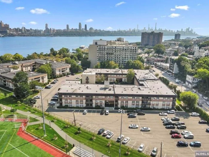 Fantastic opportunity to own this studio condo, perfectly situated just 5 minutes from the George Washington Bridge and mere steps from convenient NYC transportation. Nestled along the scenic Hudson Riverfront, this residence is surrounded by boutique shops, exceptional dining options, the vibrant energy of Veterans Field, and an exciting nightlife scene. 1111 River Road Plaza boasts two impeccably maintained buildings, each featuring a stunning central pool. Additional amenities include an assigned parking space and laundry facilities on every floor.