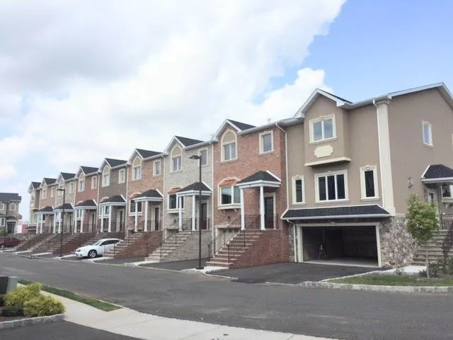 Freshly Painted! Experience modern living in this spacious 2, 900 sq. ft. townhome, built in 2015 and located in the sought-after Jacob's Landing Waterfront Community. Just 6 miles from NYC, this three-level home features 3 bedrooms, 3.5 baths, a walk-out basement/family room, and a two-car garage. The main floor offers an open-concept layout filled with natural light. The aesthetically designed white kitchen is equipped with stainless steel appliances, a granite island, ample cabinetry, and a breakfast nook that leads to a private terrace. Relax in the family room by the fireplace or step out onto the deck for outdoor entertaining. Upstairs, the primary suite boasts a spa-like bath and walk-in closets. Two additional bedrooms and a full bath complete the upper level, ideal for kids bedrooms or guest rooms. The lower level provides flexible space for a home office, gym, or guest suite with full bath, laundry room, and access to the backyard. Additional features include high ceilings (9'), hardwood floors, recessed lighting, and two-zone central air. Recent updates include a new dishwasher (Nov 2022). Guest parking is readily available. Conveniently located near the NYC bus and shuttle to Secaucus Train Station, this home is ideal for commuters. Enjoy nearby attractions such as Trolley Park, the Secaucus Greenway, MetLife Stadium, American Dream Mall, and Manhattan, with easy access to Newark Airport and major highways (NJ Turnpike, GS Parkway, Lincoln Tunnel, Holland Tunnel, and GW Bridge). Don't miss this opportunity to buy/rent a beautiful home that combines urban convenience with tranquil waterfront living in a quiet, family friendly neighborhood with excellent schools.  PREMIUM UPGRADES: Custom Benjamin Moore wall/molding/ceiling paint, Custom hardwood flooring in modern light grey finish, Custom wood tiles in kitchen and basement, Jacuzzi & Rain Shower in master bathroom! Balcony with patio furniture included! Modern crystal chandelier in dining room and beautiful chain chandelier in foyer available for fee at buyer's request.  OPEN HOUSE : Jan 26 Sunday 12:00- 2:00 PM