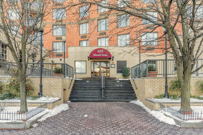 Discover urban living at its finest in this stunning 12th-floor condo located in the heart of downtown Hoboken. This beautiful two-bedroom, two-bathroom residence boasts elegant hardwood floors and breathtaking views of Manhattan from almost every window. Wake up to the city sunrise on your private balcony, the perfect spot for morning coffee or evening relaxation. Convenience is key with laundry just outside your door (one W/D room on every floor) and an elevator for easy access. Plus, enjoy the added bonus of a gym in the building and not one, but two deeded full size parking spots in the upper level of the garage. Don't miss this opportunity to live in a vibrant community with incredible city views!