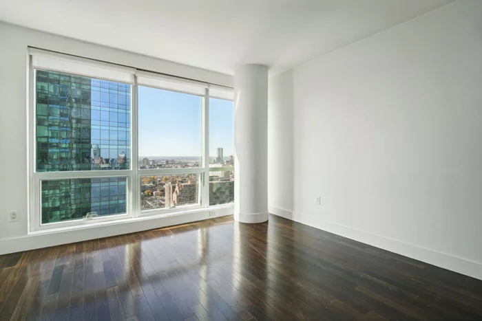 A rare offering at the iconic 77 Hudson Street, Downtown Jersey City's premier waterfront condominium. With one garage parking space included, this South/West-facing residence bathes in natural light with floor to ceiling windows, whilst offering breathtaking views. Situated in Paulus Hook, one of the most prestigious neighborhood of Jersey City which includes the highly sought-after P.S. 16 school district. 77 Hudson features two floors of resort-style amenities, including a rooftop pool, Jacuzzi, hot tub, grill area, fire pit, pet grooming room, conference room, landscaped rooftop park, cinema, gym, yoga room, steam room, sauna, in-unit laundry, community lounge, and much more. Perfectly suited for commuters, residents enjoy unmatched convenience with the light rail just steps away, a 3-minute walk to the PATH and ferry.