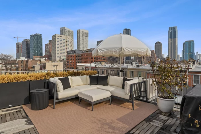 You'll fall in love with this beautifully restored top floor condo in a historically preserved building, gut renovated in 2022, in the heart of downtown Jersey City. Its interior and 458 sq. ft. private rooftop terrace offer modern luxury intertwined with its original charm. The sun- drenched open concept living, dining and kitchen areas are bright and inviting with Thibaut luxury grass-cloth wall-paper throughout and custom built-in shelving and custom closets that are elegant and functional. The kitchen is fitted with hidden Bosch stainless steel appliances, quartz countertops and custom cabinetry. Two modern bathrooms are thoughtfully designed with high-end fixtures and sleek finishes. Retreat to your brand-new fully private rooftop terrace with breathtaking skyline views. Completed in 2024, your outdoor retreat is ideal for entertaining with internet access and power outlets all around. 10 Bright Street is near restaurants, boutique shopping, cultural attractions, and a short distance from Grove Street PATH train for a quick commute to Manhattan.