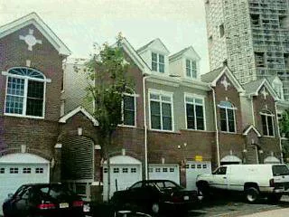 SOUGHT AFTER FULTON STYLE TOWN HOME. 24 FOOT VIEW BALCONY. WALL OF WINDOWS IN LIVING ROOM BOASTING SPECTACULAR NYC AND WATERFRONT VIEWS. 14 FT CATHEDRAL CEILING IN LIVING ROOM. PRIVATE ELEVATOR. FIREPLACE. CHERRY KITCHEN CABINETRY AND HARDWOOD FLOORS. MIDNIGHT BLACK KITCHEN COUNTERTOPS AND BACKSPLASH. NEAR POOL. EXTRA PARKING, WNY TAXES. MUST SEE.