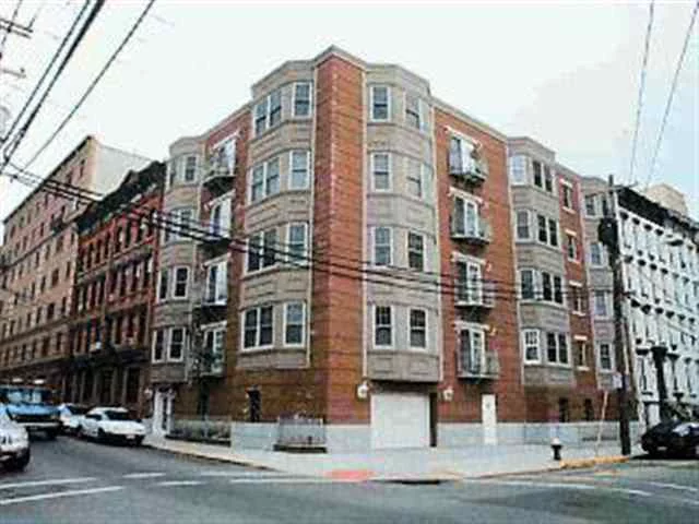 STUNNING 3BED 2BATH CONDO IN GREAT LOCATION, CORNER OF GARDEN AND NEWARK ST THIS AMAZING UNIT BOAST A FULLY APPLIANCES KITCHEN W STAINLESS STEEL APPLIANCES, GRANITE COUNTER TOP AND BREAKFAST BAR, CHERRY WOOD CABINETS, 2 MARBLE BATHS, 2 BALCONIES, GAS FIREPLACE, BUILT IN BOOKSHELVES, WASHER AND DRYER IN UNIT, WINDOW GALORE AND DEEDED PARKING SPOT.