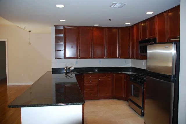 Beautiful two year young condo with easy transportation to NY. This home boasts a large kitchen with 42 custom cabinets, stainless steel appliances and granite countertops. Both bathrooms have marble floors. This home also has 2 indoor parking spaces!