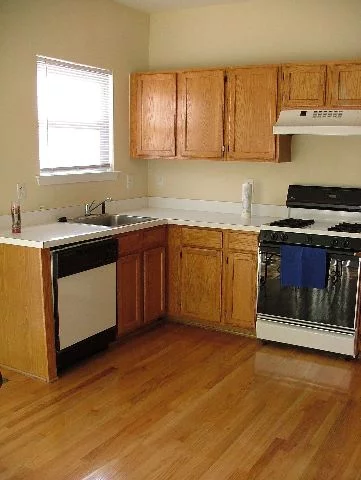 Beautiful 2 Bedroom Triplex unit in prestigious gated Society Hill of Jersey City Community. Large living area with large deck off kitchen overlooking manicured lawn. Wood floors through out with gas fireplace in family room. Amazing unit. Shows great. Don't take my word for it, come see yourself. Garage unit.