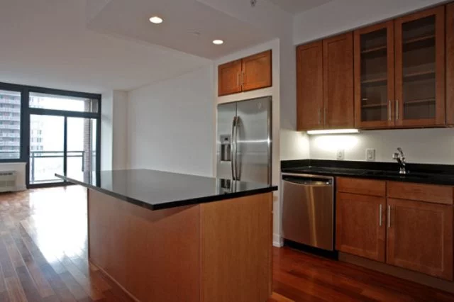 Wonderful one bedroom with balcony overlooking NYC and Hudson River. 756 Sq Ft of spacious living with an open kitchen, 42 maple cabinets, granite countertops, center island, with stainless steel appliances. Unit features floor to celing windows, 9ft celings, and washer/dryer in unit. Building has 24 hour conceirge, fitness center, sun deck, shuttle to Path and a one deeded parking spot.