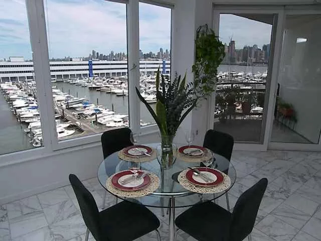 AT RIVA POINTE EVERYDAY FEELS LIKE A LUXURIOUS CRUISE VACATION. HIGHLY DESIRED & RARELY OFFERED 3 BDRM, 3.5 BTH DUPLEX PENTHOUSE W/ OUTDOOR TERRACE SITUATED ON A PIER OVERLOOKING MARINA. GREAT VIEWS OF HUDSON RIVER & MIDTOWN MANHATTAN NORTH TO THE GWB. DELUXE FEATURES INCL. FIREPLACE, LG. WINDOWS, FRESH PAINT & CARPET. ITALIAN TILE IN LR/DR & KITCHEN IS ELEGANT. 24 HR CONCIERGE, FITNESS CNTR & INDOOR POOL. RESERVED PARKING INCL. NY FERRY TO MANHATTAN & NJ TRANSIT STOP ON SITE. LIGHT RAIL ACROSS STREET.