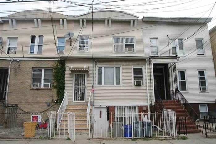 3-Family in up and coming area of Journal Square. All renovations completed in 2008 include: plumbing, electric, roof, kitchens + baths. Top 2 units are occupied. Close to transportation, buses to NYC. All separate utilities, very large backyard.